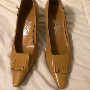 Ferragamo Tan leather pumps with tassels.